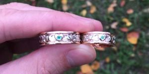 pair of wedding rings with colored stones