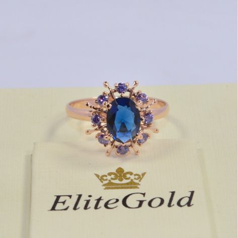 кольцо в видео солнца с синими камнями в красном золоте