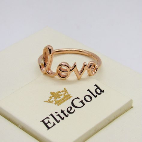 золотое кольцо в виде надписи "Love"