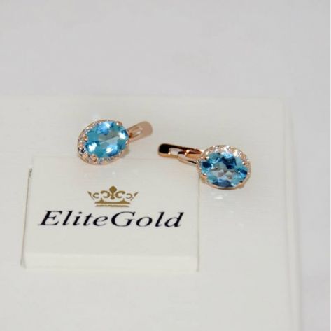 в красном золоте с синими камнями