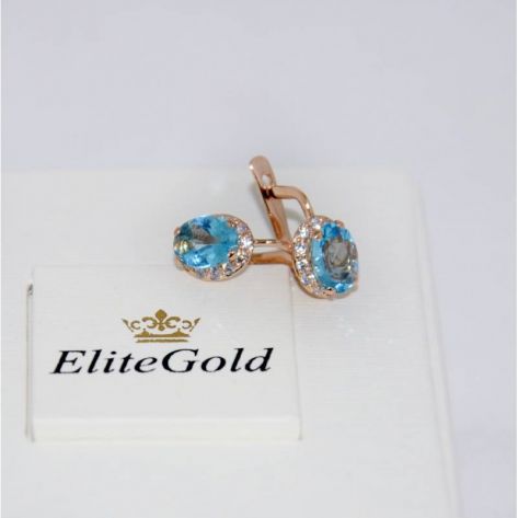 в красном золоте с синими камнями