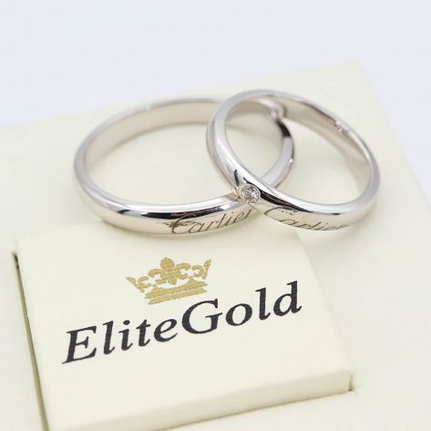 Классические обручальные кольца с надписью Картье в белом золоте