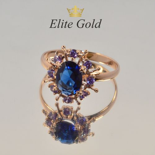 кольцо в видео солнца с синими камнями в красном золоте