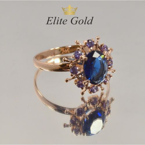 кольцо в видео солнца с синими камнями в красном золоте
