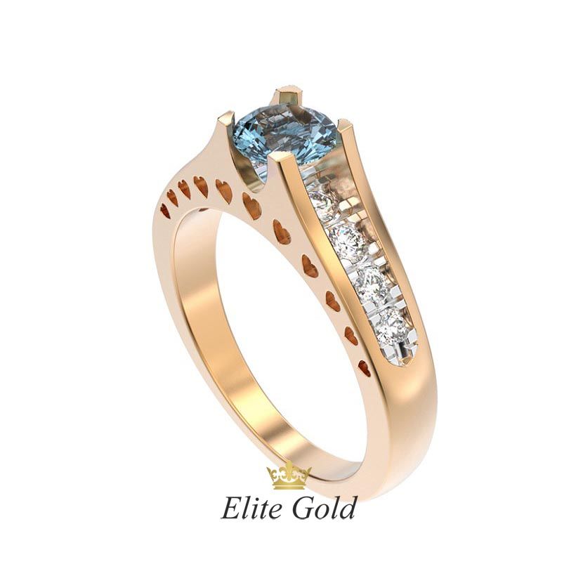 кольцо Isabella в красном и белом золоте с голубым камнем